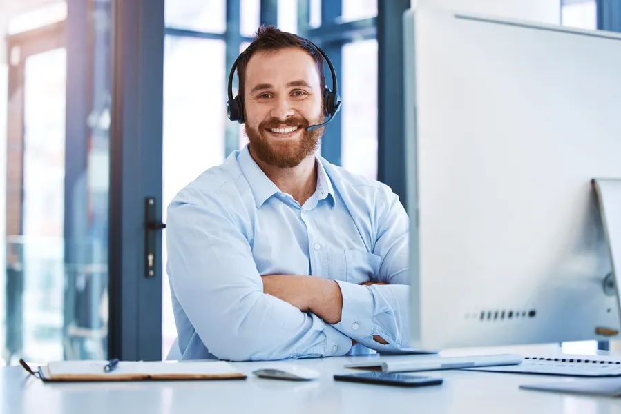 Computer Repair Technician with Headset On Ready To Answer Your Call